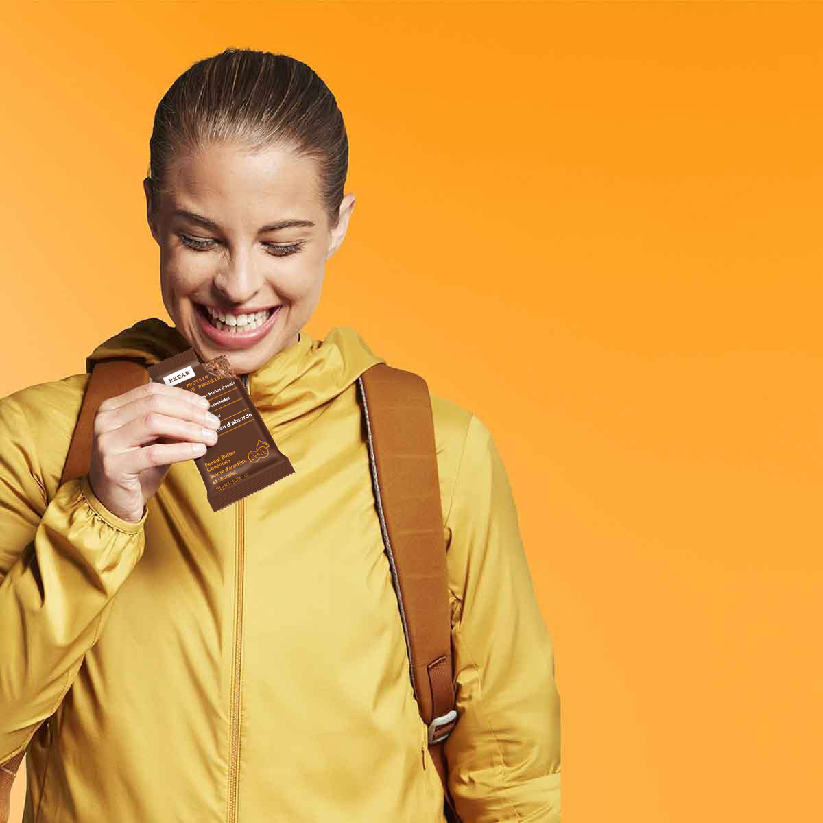 Woman holding RXBAR Peanut Butter Chocolate